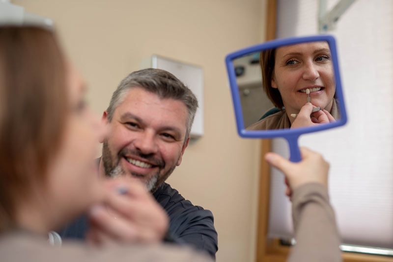 Patient checking out veneer options